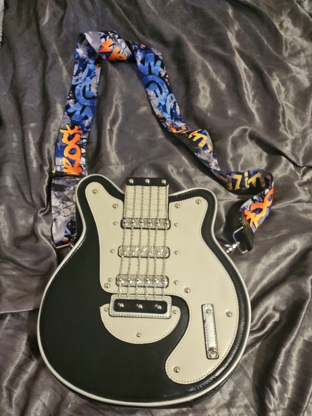 Black and Cream Guitar-Shaped Crossbody Bag with Graphic Strap